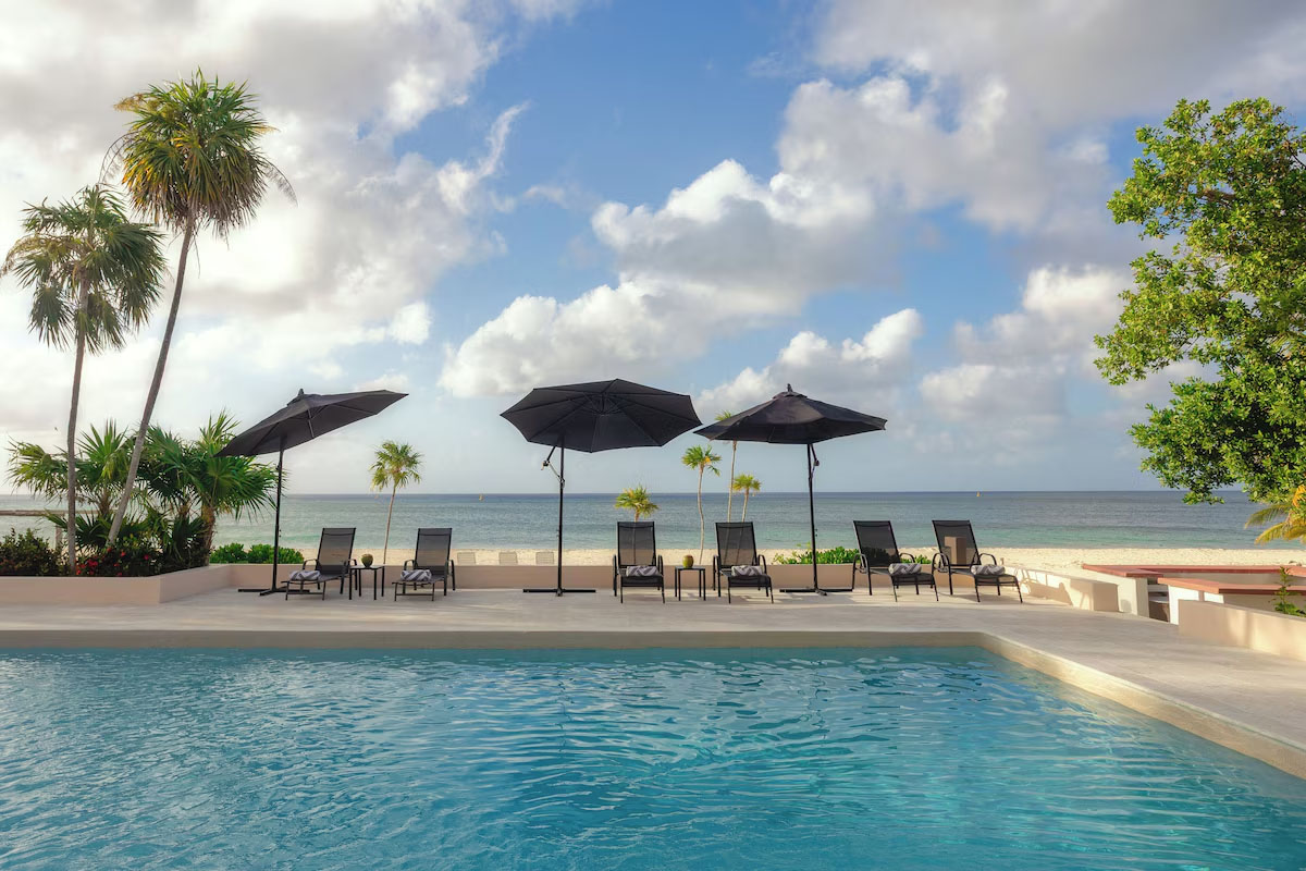 The pool and beach of Casa La Playa, a beachfront rental villa in Cozumel