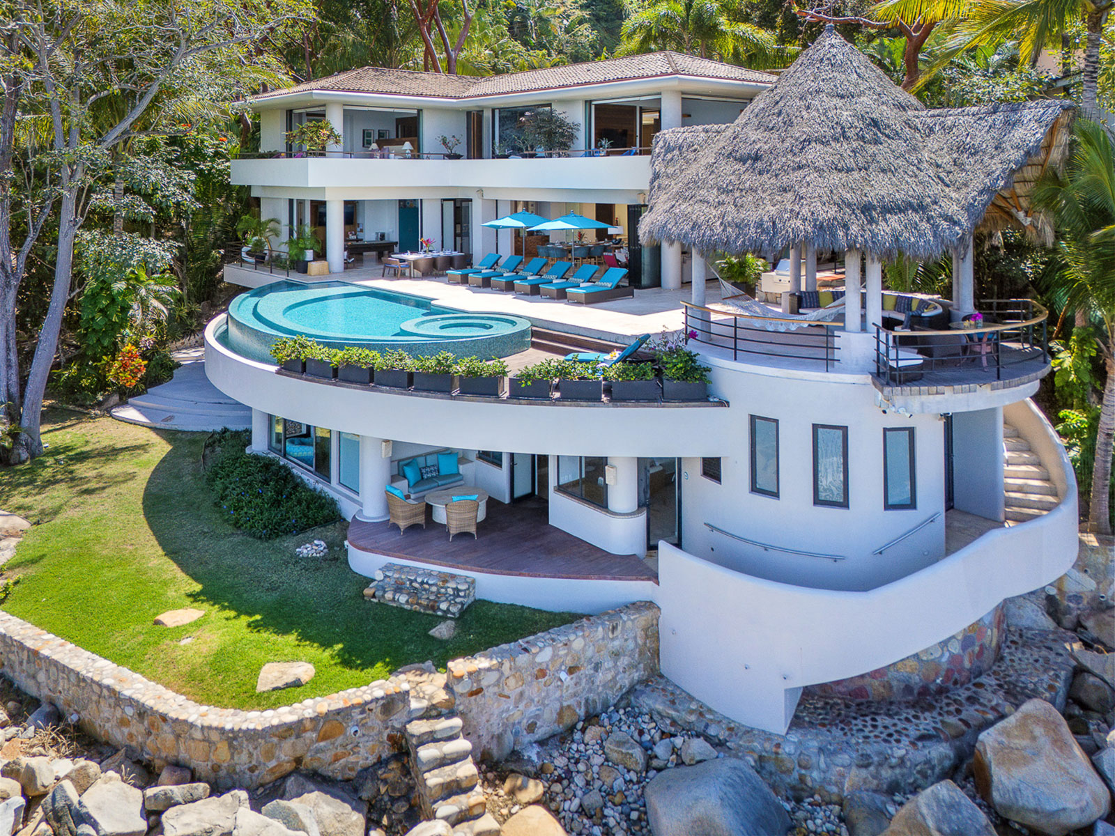 Casa Peña del Mar, a rental villa on the south shore of Puerto Vallarta, stepping down a green hillside above Banderas Bay